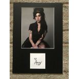 Amy Winehouse autograph mounted with 10 x 8 inch colour photo to an overall size 16 x 12 inches.