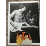 Spencer Davis and Steve Winwood signed irregularly cut music magazine page.