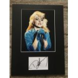 Debbie Harry autograph mounted with 10 x 8 inch colour photo to an overall size 16 x 12 inches.