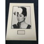 Audrey Hepburn signed piece mounted with b/w portrait photo.