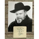 Orson Wells signed note on autograph album page with 10 x 8 inch b/w unsigned photo. Condition 9/10.