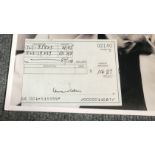 Leonard Cohen signed half of US bank cheque with unsigned b/w photo. Condition 9/10. All