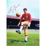 Autographed RON YEATS 16 x 12 photo - Col, depicting the Liverpool centre-half striking a