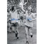 Autographed SOUTHAMPTON 12 x 8 photo - B/W, depicting MIKE CHANNON and DAVID PEACH holding aloft the