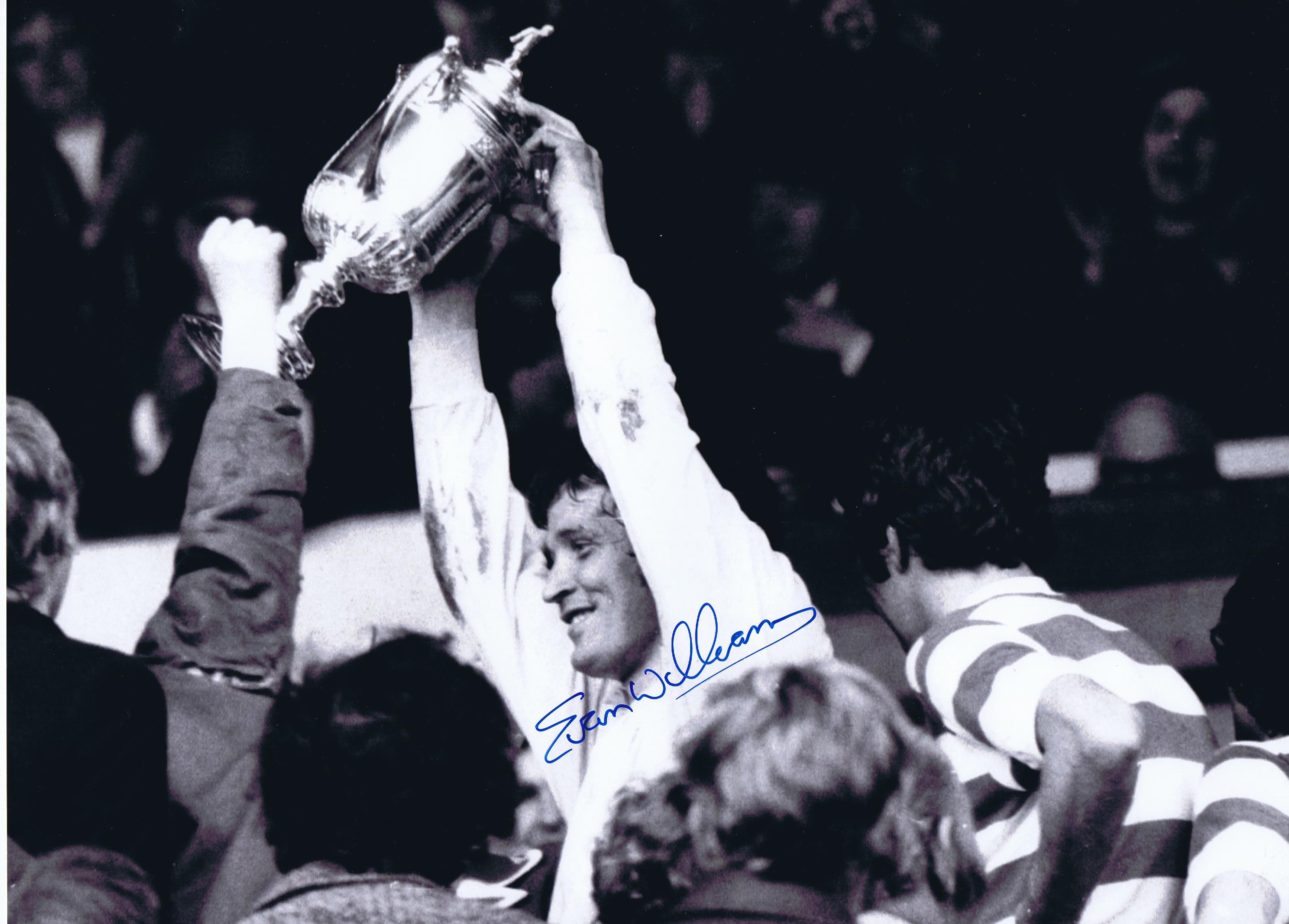 Autographed EVAN WILLIAMS 16 x 12 photo - B/W, depicting the Celtic goalkeeper holding aloft the