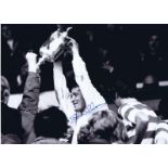 Autographed EVAN WILLIAMS 16 x 12 photo - B/W, depicting the Celtic goalkeeper holding aloft the