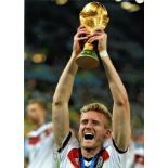 Football André Schurrle signed 16x12 colour photo pictured lifting the World Cup while playing for