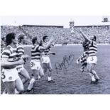 Autographed DANNY McGrain 16 x 12 photo - B/W, depicting the Celtic captain throwing the Scottish