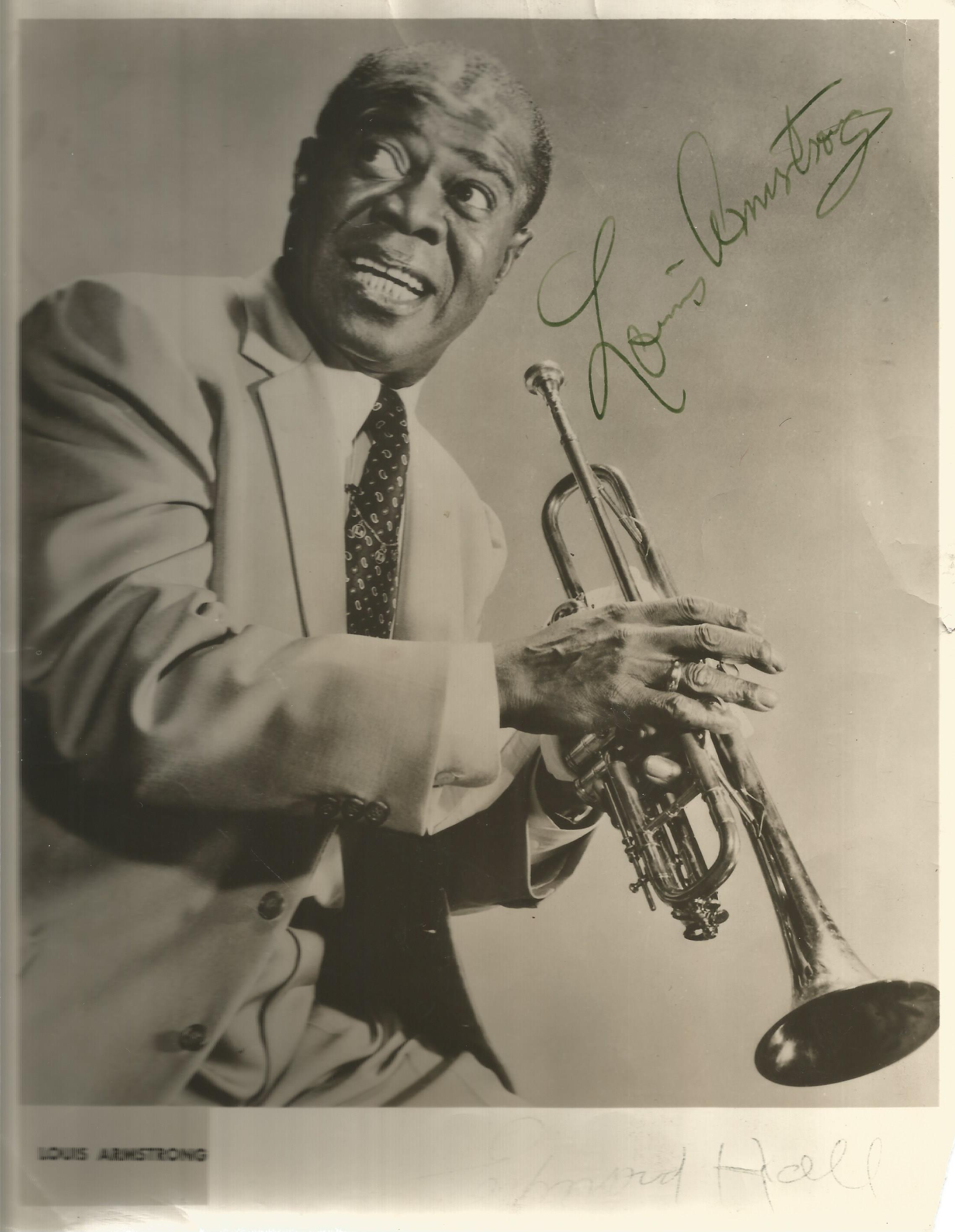 Louis Armstrong signed 10x8 black and white photo. Few knocks and creases to photo. Good