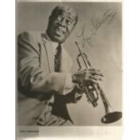 Louis Armstrong signed 10x8 black and white photo. Few knocks and creases to photo. Good