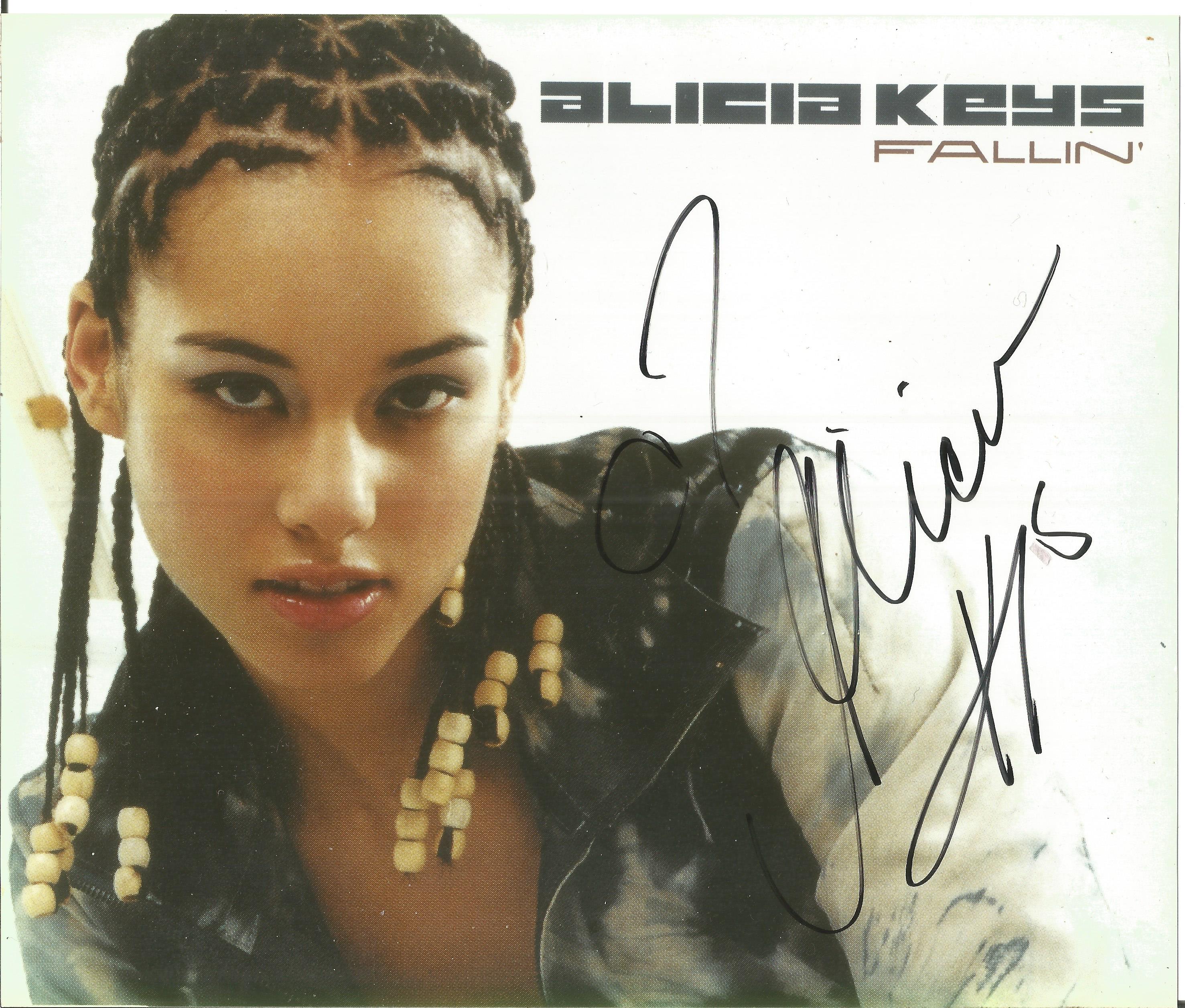 Alicia Keys signed 10x8 colour photo. Good condition. All autographs come with a Certificate of