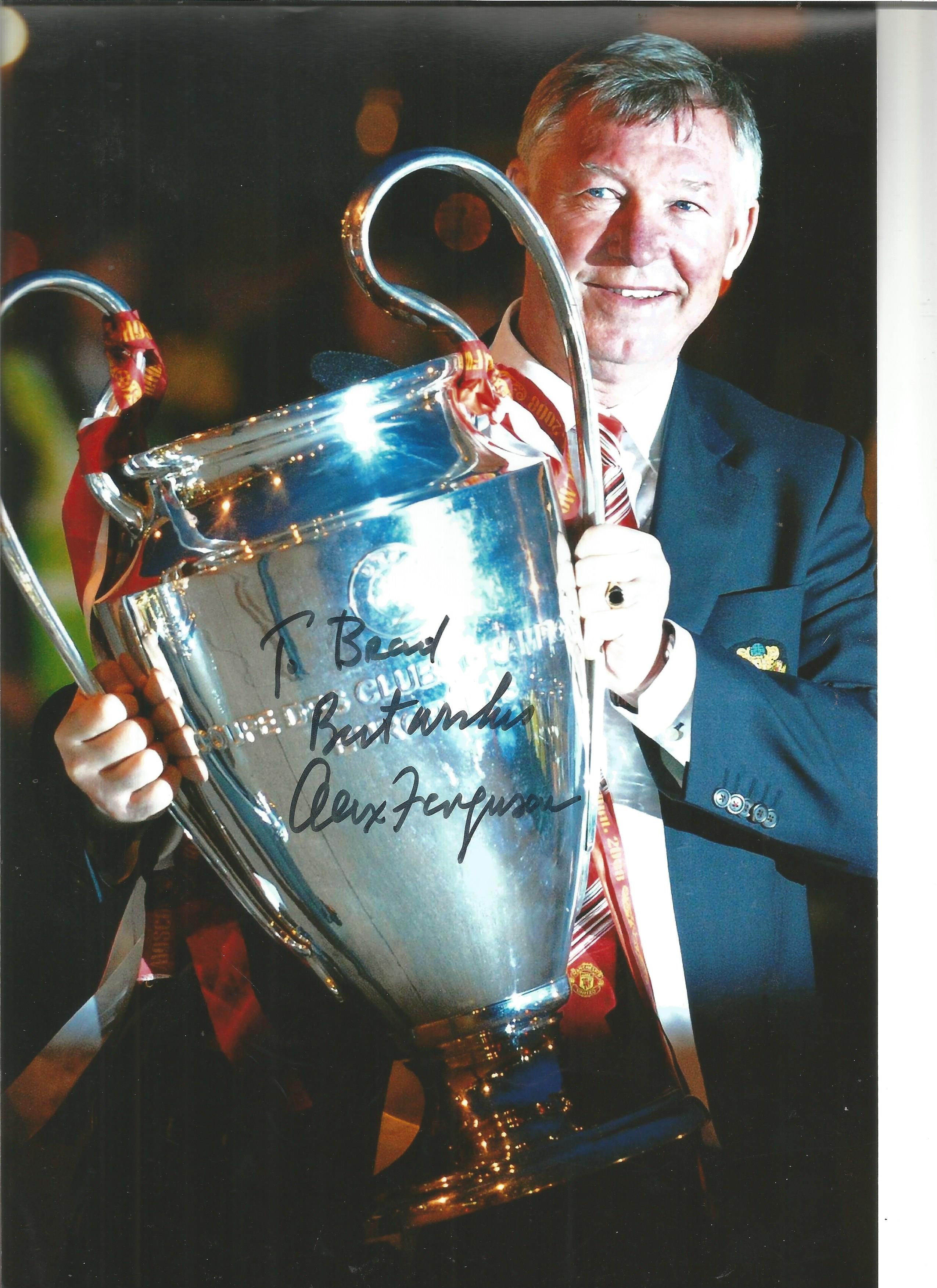 Alex Ferguson signed 12 x 8 inch colour photo to Brad with European Trophy. Good condition. All