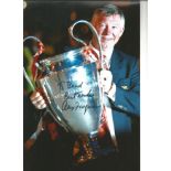 Alex Ferguson signed 12 x 8 inch colour photo to Brad with European Trophy. Good condition. All