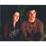 Kirsten Stewart and Taylor Lautner signed Twilight 10x8 colour photo. Good Condition. All autographs