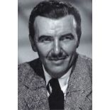 Preston Foster Signed 7 x 5 inch portrait photo, autograph against busy background, 'Fost' against