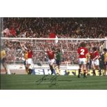 Football Gordon McQueen signed 12x8 colour photo pictured while playing for Manchester United.