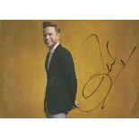 Olly Murs signed 12x8 colour photo. Good Condition. All autographs come with a Certificate of