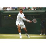 Tennis Milos Raonic signed 12x8 colour photo pictured in action at Wimbledon. Canadian