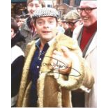 Sir David Jason signed 10 x 8 inch colour photo in half - length pose as Del Boy. Good Condition.