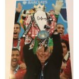 Alex Ferguson signed 12 x 8 inch colour photo celebrating with Premiership Trophy. Good condition.