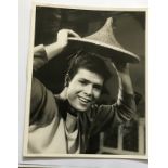 Cliff Richard signed vintage 10 x 8 inch b/w still photo from Aladdin. Few dings condition 7/10.