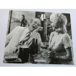 Barbara Windsor signed 12 x 8 inch magazine photo, at bar with Sid James. Good condition. All signed