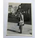 Barry Sheene Motorcycle ace signed 8 x 6 inch b/w photo doing wheelie on trials bike. Good