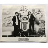 Bee Gees signed 10 x 8 inch b/w magazine page, signed by all three. Condition 7/10. Good