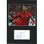 Ronaldo signature piece mounted below colour photo. Approx overall size 16x12. Good Condition. All
