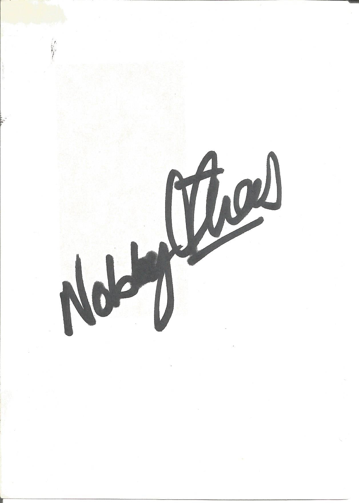 Nobby Stiles signed album page. Good Condition. All autographs come with a Certificate of