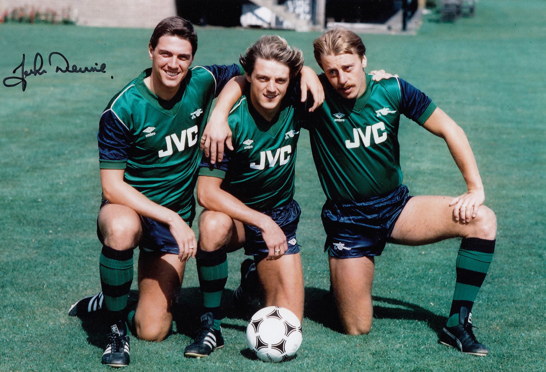 Autographed John Devine 12 X 8 Photo - Col, Depicting Devine Posing With His Arsenal Team Mates