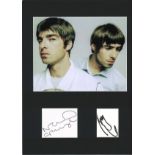 Oasis signature pieces mounted below colour photo. Approx overall size 16x12. Good Condition. All