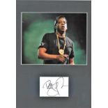 Jay Z signature piece mounted below colour photo. Approx overall size 16x12. Good Condition. All