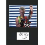 Billy Idol signature piece mounted below colour photo. Approx overall size 16x12. Good Condition.