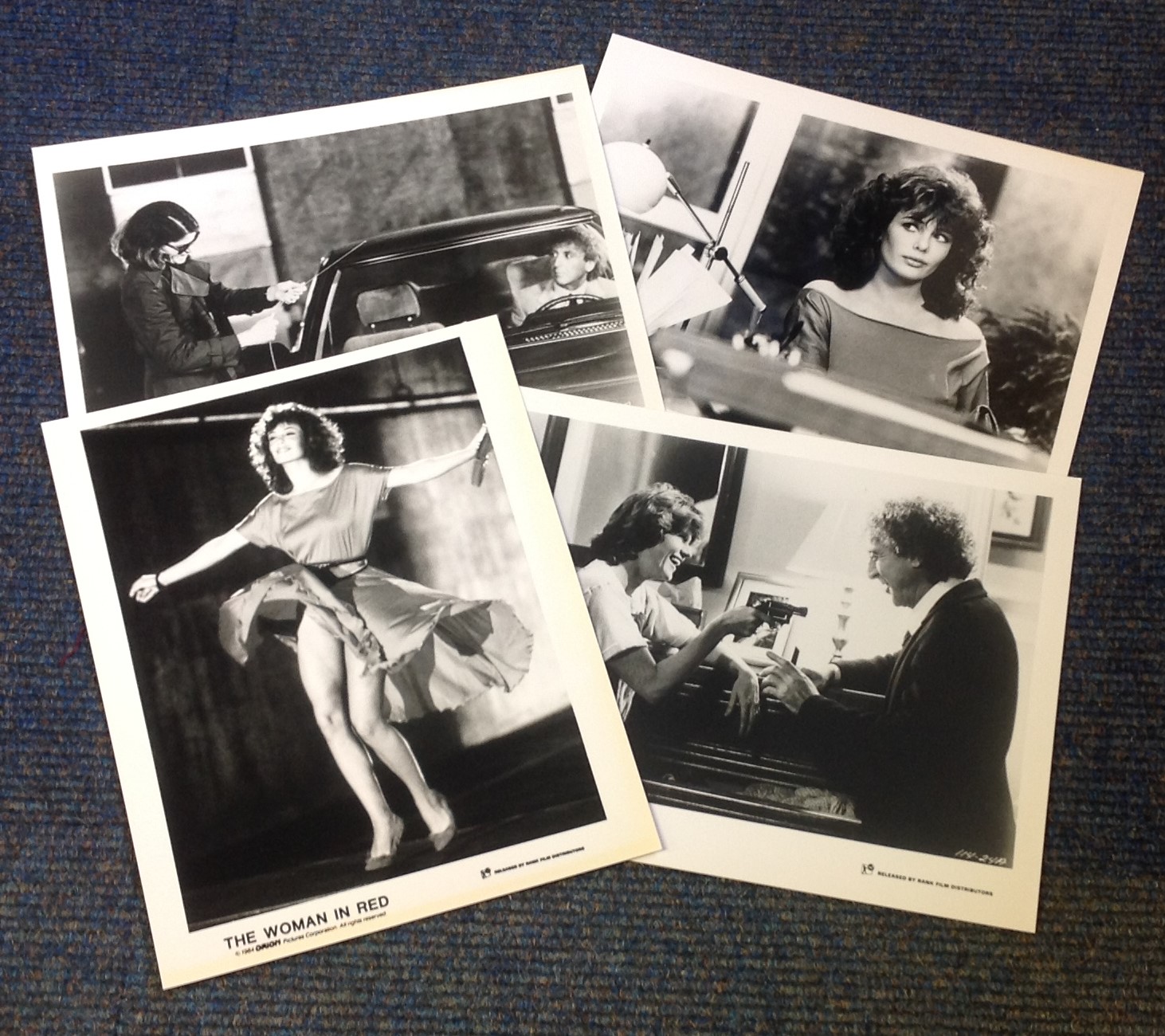 The Woman in Red collection of 4 lobby cards from the 1984 Romantic comedy film directed by and