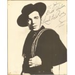 Lash Jack La Rue signed 14 x 11 b/w vintage photo in western costume, dedicated. Has faults signs of