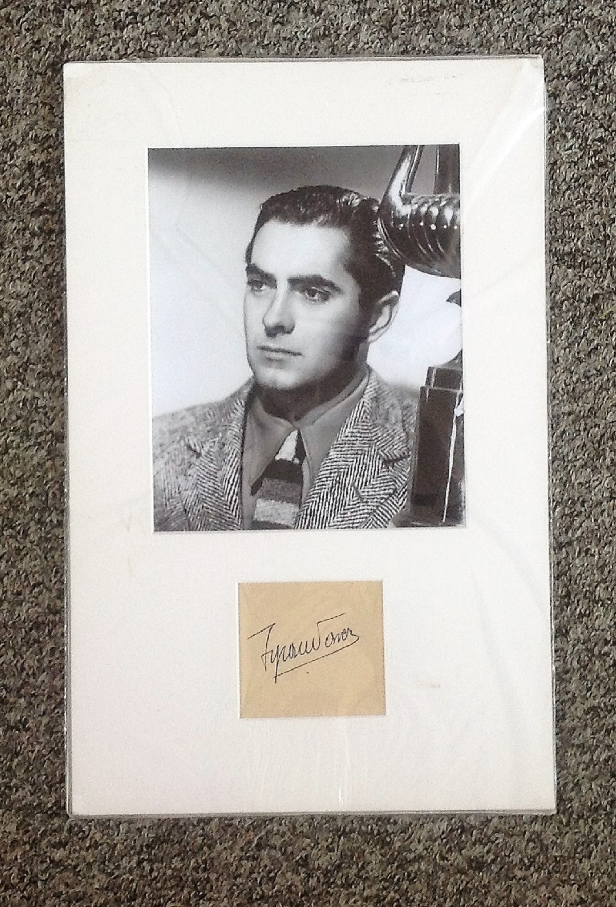 Tyrone Power signature piece mounted below black and white photo. (May 5, 1914 - November 15,