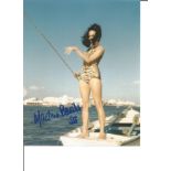 Martine Beswick signed 10x8 colour image featuring her in a tiger print swimsuit out at sea and