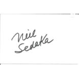 Neil Sedaka signed white card. Good Condition. All autographs come with a Certificate of