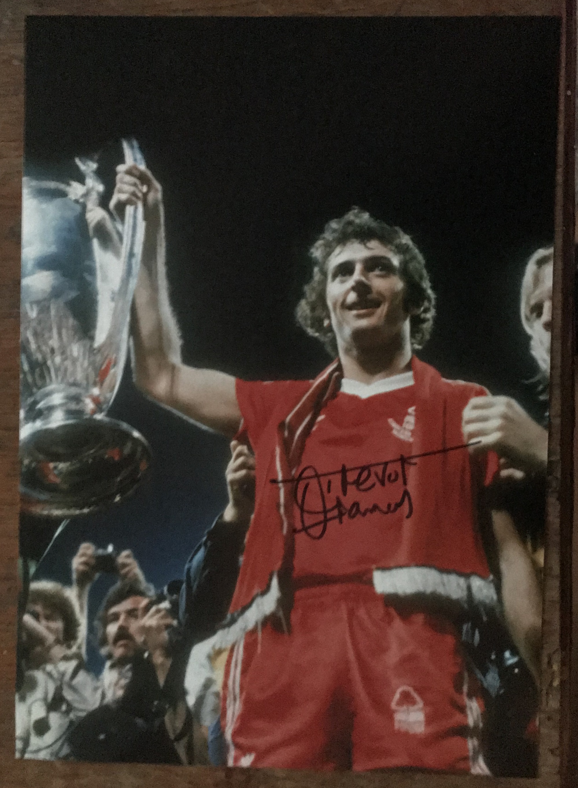 Football Trevor Francis signed 12 x 8 inch colour photo holding the European Cup. Good Condition.