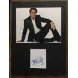 Cliff Richard Music autograph on white card matted with colour photo into display approx 16 x 12