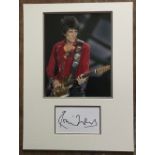 Ronnie Wood Rolling Stones Music autograph on white card matted with colour photo into display