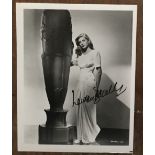 Lauren Bacall signed 10 x 8 inch b/w full length photo. Good Condition. All autographs come with a