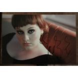 Adele signed 12 x 8 inch colour photo. Good Condition. All autographs come with a Certificate of