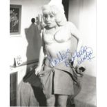 Barbara Windsor signed 10 x 8 b/w cheeky photo from Carry on Nurse. Good condition. All autographs