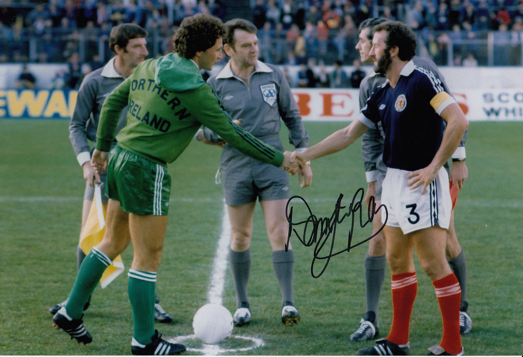 Autographed Danny McGrain 12 X 8 Photo Col, Depicting The Scotland Captain Shaking Hands With His