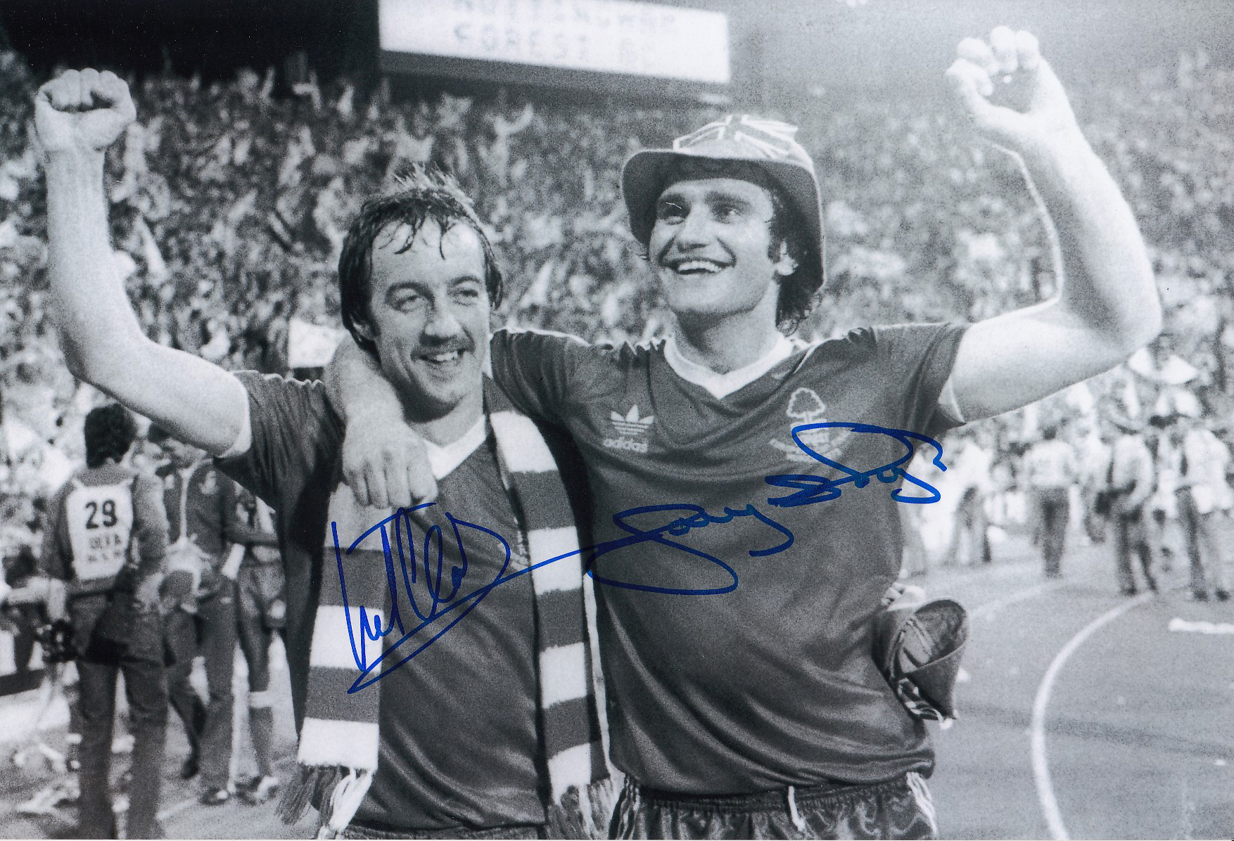 Autographed Nottm Forest 12 X 8 Photo B/W, Depicting Frank Clark And Larry Lloyd Arm In Arm As