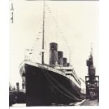 Titanic survivor Millvina Dean signed 8 x 8 inch b/w photo of the ship in dock. Good condition.