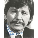 Charles Bronson signed 10 x 8 inch b/w early portrait photo, to Richard. Good condition. All