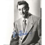 Robert Mitchum signed 10 x 8 inch b/w early portrait photo. Good condition. All autographs come with
